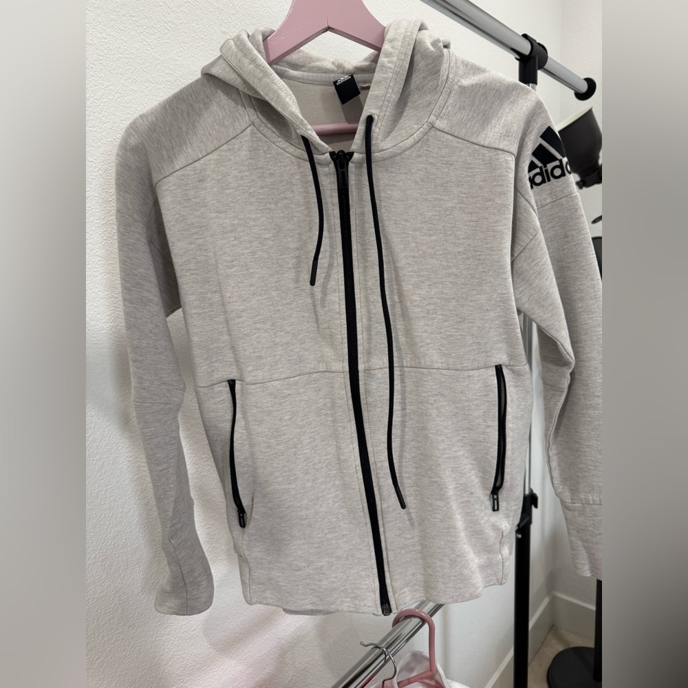 Adidas hoodie. Off White color. Used in great condition. Zipper pockets.